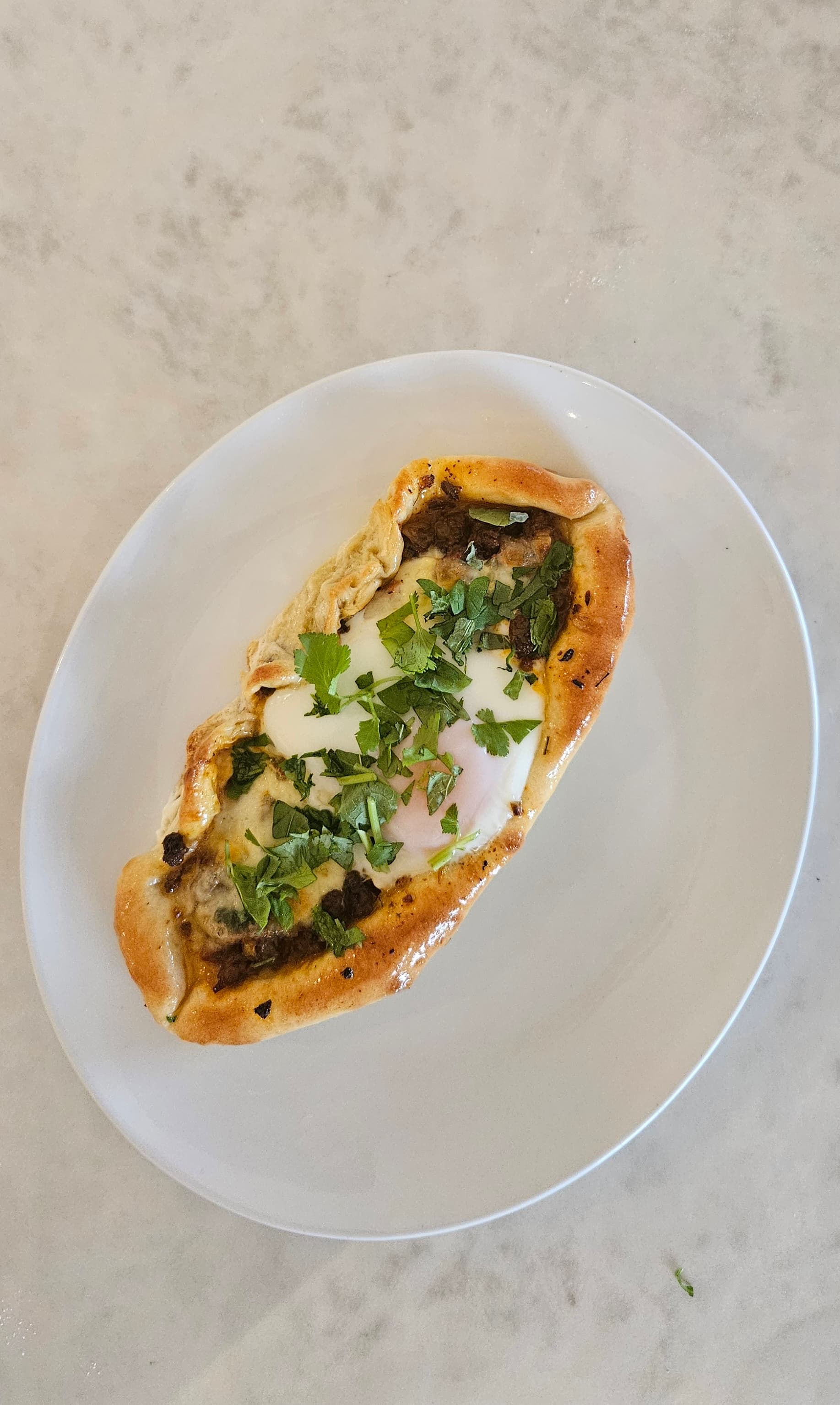 Turkish pide on white plate